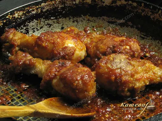 Fried chicken legs in sauce